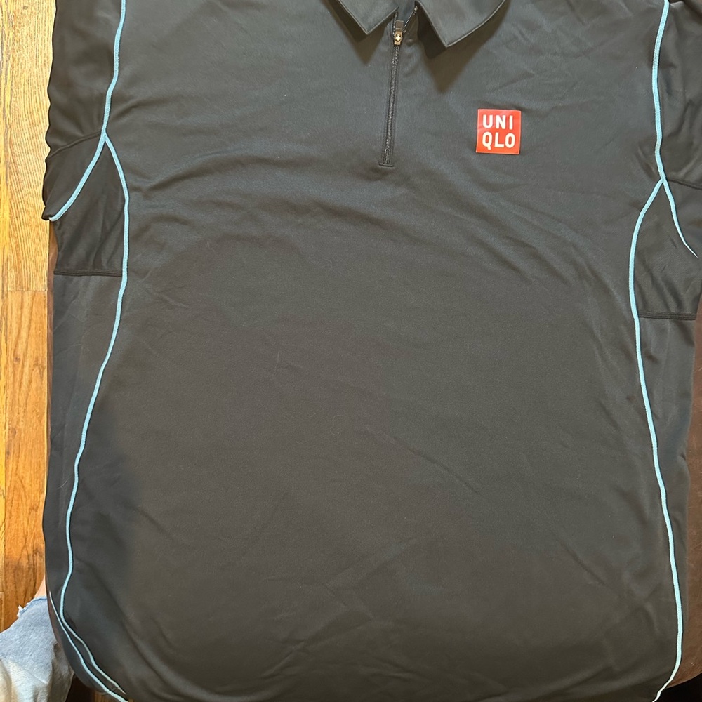Uniqlo Men's Black Polo with Blue Accents